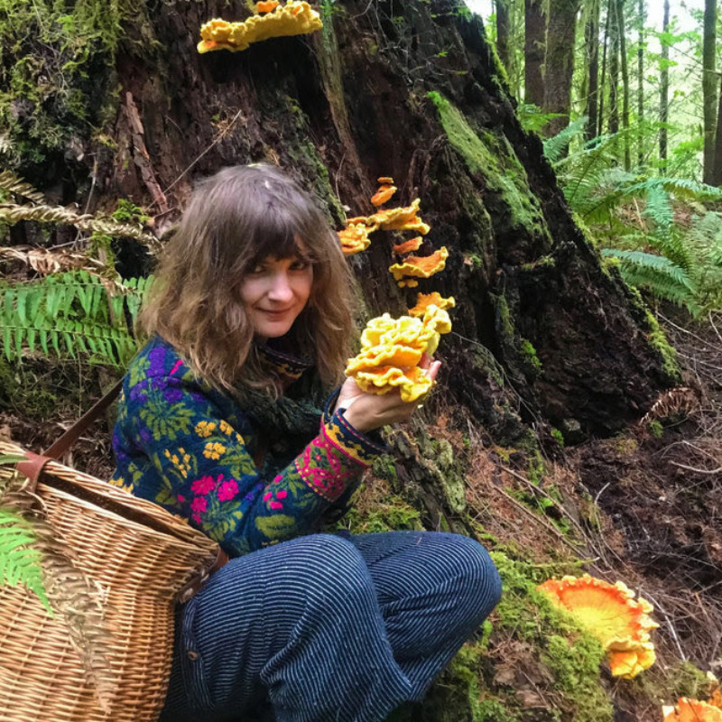 Foraging and Camp Cooking Foray, Coyle Outside, Corvallis, Oregon, via Newsletter - A woman holds up foraged mushrooms in the forest
