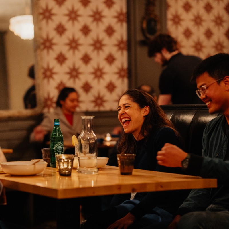 Lucca Taverna, Corvallis, Oregon - Visit Corvallis - A groups of friends enjoys dinner at Lucca Taverna